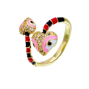 Detail of gold snake ring with colorful enamel inlay and sparkling cubic zirconia stones