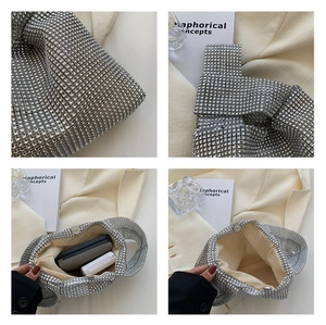Detail of silver rhinestone handbag showing interior lining, magnetic clasp and capacity