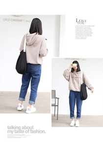 Detail showing back view and front close-up of apricot hoodie with blue denim jeans