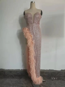 Detail of pink sequin evening gown showing deep V neck and mesh ruffle trim