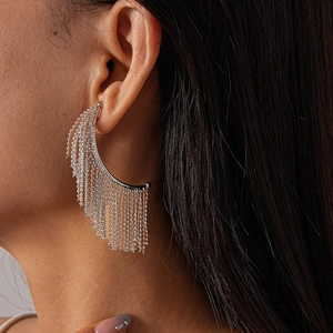 Elegant silver tassel earrings with metallic chains shown on model for a stylish look