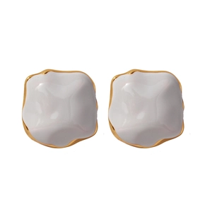 Irregular square enamel stud earrings in creamy white and gold with textured surface