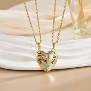 Golden split heart pendant necklaces with Lil Sis Big Sis text and butterfly detail