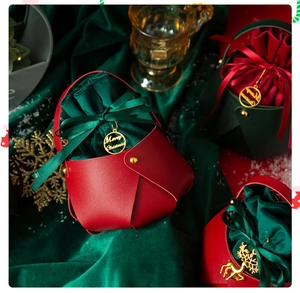 Close-up of premium red and green PU leather Christmas gift bags with gold Merry Christmas tags