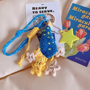 Handmade crochet star keychain featuring a blue teardrop pendant and smiling face charms