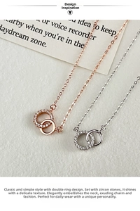 Close-up of 925 silver interlocking rings necklace with micro-paved cubic zirconia stones