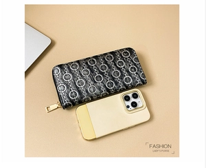 Long faux leather wallet with silver chain pattern and gold zipper shown next to a phone