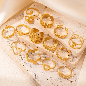 Collection of minimalist 18K gold plated stainless steel rings in snake and heart shapes