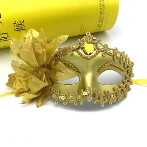 Golden Venetian masquerade mask with large yellow side flowers and sequin trim details