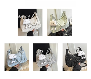 Detail of satin bag with 3D butterfly ornament, cloud charm and silver chain strap