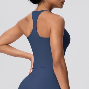 Detail view of racerback yoga tank top showing seamless fit and high-stretch blue fabric