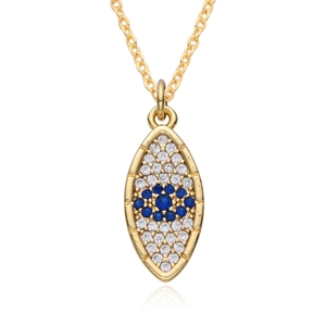 Detailed close-up of 18K gold evil eye pendant with blue and white zircon stones