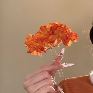 Elegant orange fabric flower hair pin with golden metal fork for women's hairstyling