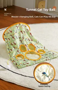 Detail of a foldable green cat tunnel with forest prints and hanging plush ball toy