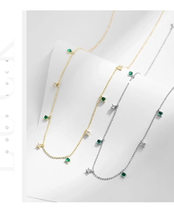Detail of s925 silver beaded necklaces with emerald crystals and gold finish options