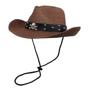 Brown straw cowboy hat with leather band and silver skull ornament for outdoor wear