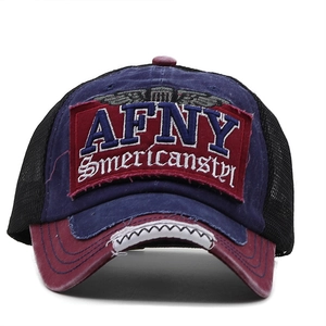 Detailed embroidery of AFNY patch and frayed edges on the red brim of a trucker hat