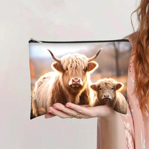 Detail of Highland cow print on canvas makeup bag with premium zipper closure