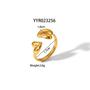 Detail view of adjustable gold-plated heart ring with 1.7cm diameter and 1.0cm heart charm