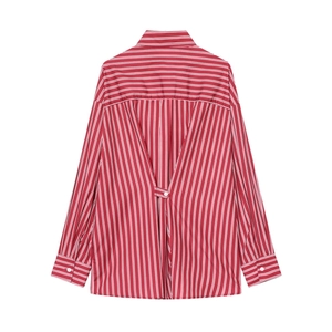 Detail view of red and white striped shirt featuring unique V-shaped back pleat and strap