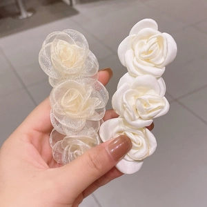 Elegant white camellia flower hair clips in organza and satin for summer styling
