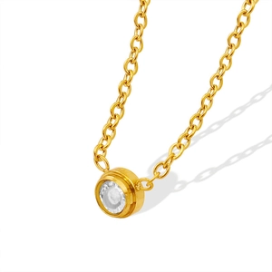 Minimalist gold titanium necklace featuring a bezel-set round crystal pendant for women