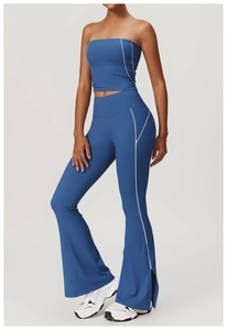 Blue yoga set featuring cropped top and flare leggings with side white stripe detail