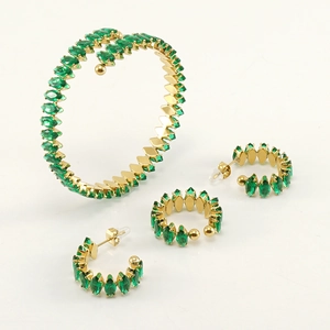 Detail view of 18K gold-plated stainless steel jewelry set with green zircon marquise stones