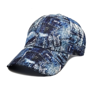 Detail of distressed denim baseball cap with vintage faded texture and curved brim