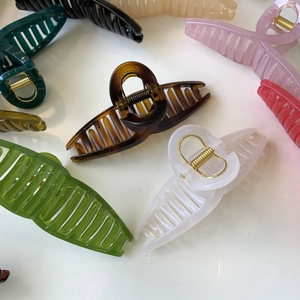 Collection of various colored 11cm large hair claw clips with gold metal springs