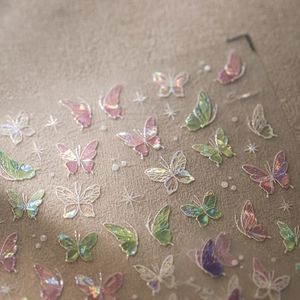 5D holographic butterfly nail art stickers with iridescent pink and green 3D butterfly motifs