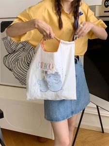 Cute elephant embroidered canvas tote bag with orange striped handles for women