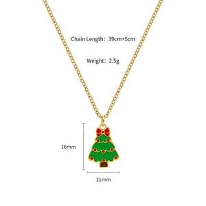 Detailed view of gold Christmas tree pendant with green enamel and size measurement