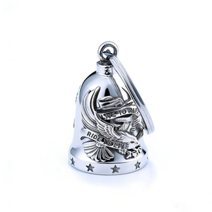 Polished stainless steel Live to Ride eagle bell pendant on a plain white background