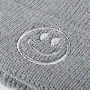 Winter thick knit beanie with embroidered smiley face in grey warm rib texture