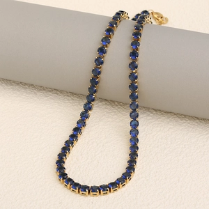 Elegant 18K gold plated necklace featuring round-cut deep blue sparkling crystals