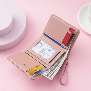 Pink three-fold short wallet for women with multiple card slots and zipper coin pocket