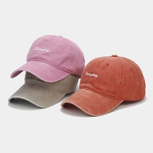 Vintage washed cotton baseball caps with Everyday embroidery in pink, khaki, and brick red