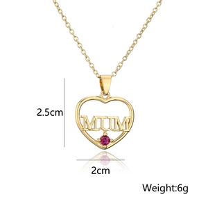 Close-up of gold heart MOM pendant with red gemstone and technical dimensions