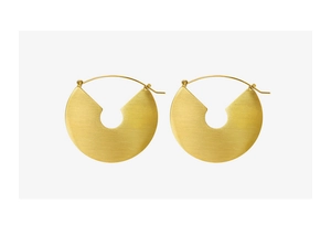 Detailed view of golden brushed texture round statement earrings with hook design