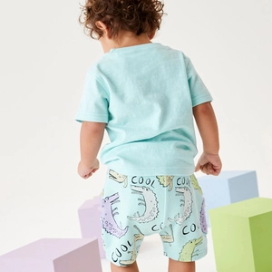 Kids short sleeve cotton set featuring light blue t-shirt and cute dinosaur print shorts