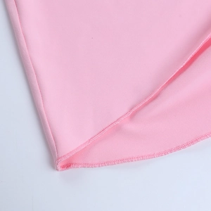 Macro shot of pink bow back dress showing fine stitching and premium fabric texture