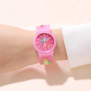 Detailed view of pink mermaid kids watch with shell charms on a child's wrist