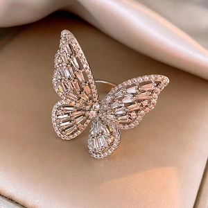Elegant silver butterfly open ring with baguette and round zircons on champagne silk