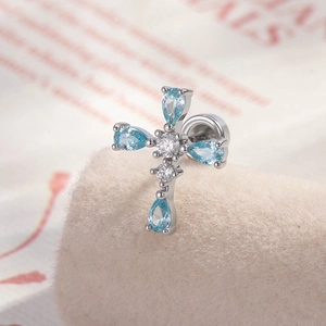 Cross earrings featuring teardrop blue zircon set in silver metal with micro-inlay detail