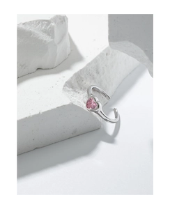 Macro shot of S925 sterling silver stamp and pink heart zircon on the ring band