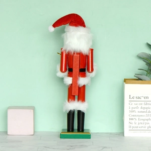 Rear view of 38cm red wooden Christmas nutcracker figurine with lever on mint green background