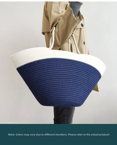 Detail view of large capacity blue and white color-block woven tote bag with thick cotton rope