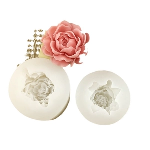White silicone jasmine flower molds with a pink floral mousse for baking and DIY soap crafts