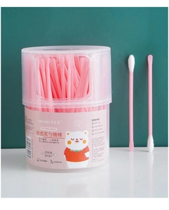 Detail of pink double-headed cotton swabs with spoon and spiral tip in a clear box